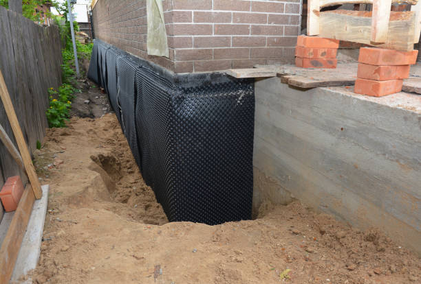Happy homeowners after waterproofing job in Manasquan